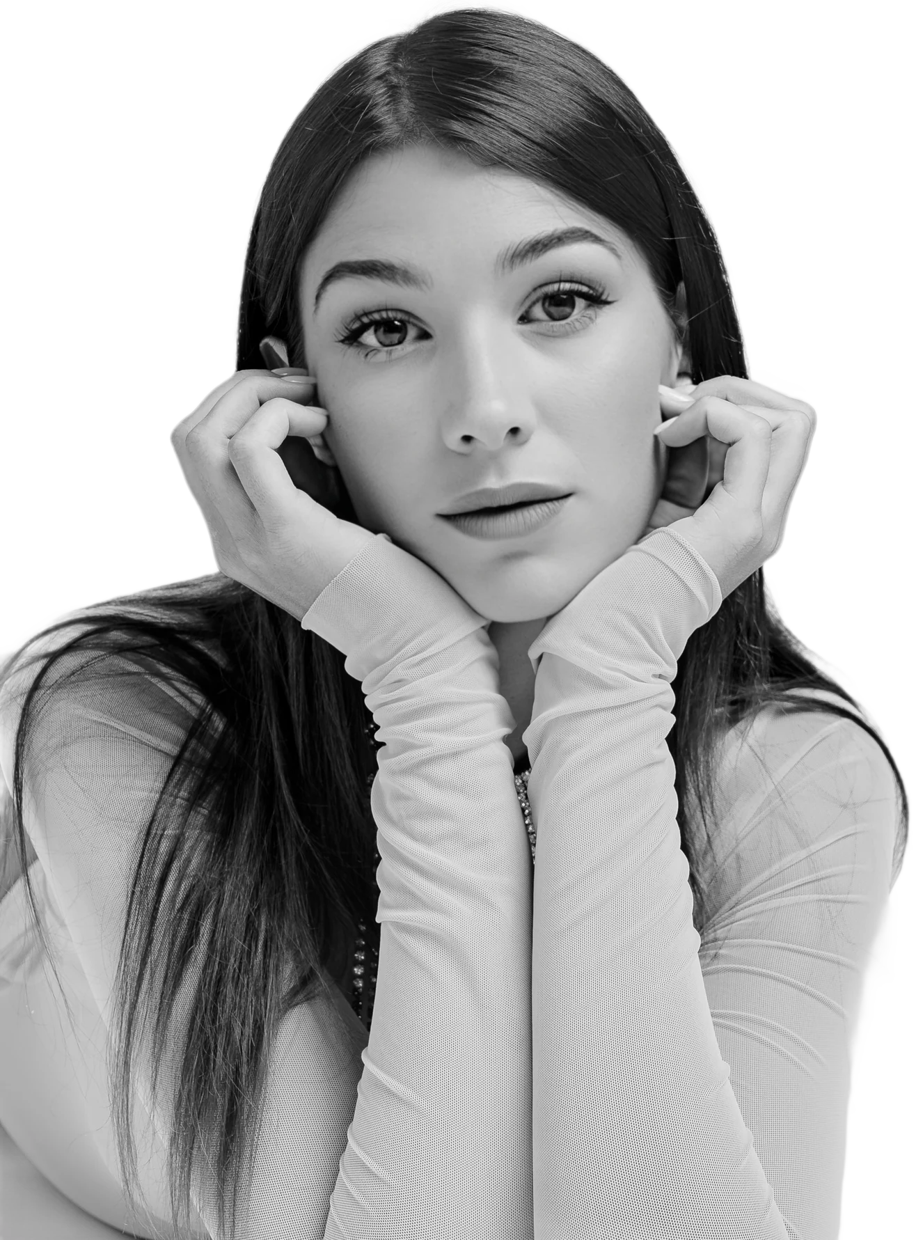 Ginevra Lamborghini in black and white, chin resting on her hands